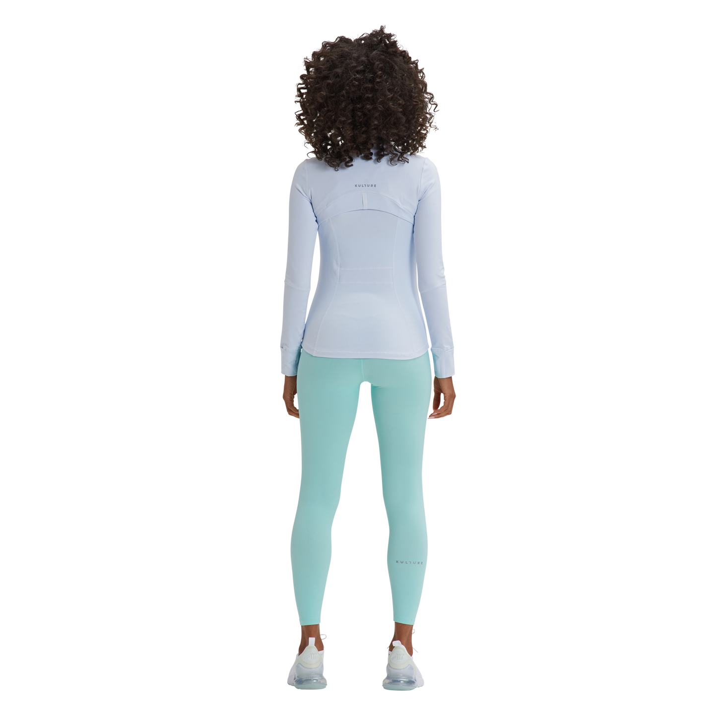 A woman in a white top and green pants is wearing Kulture's Sunset Define Full-Zip Jacket with Pockets.