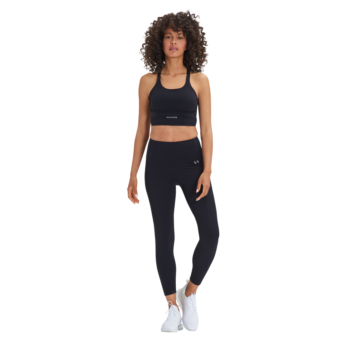 A woman in Kulture's Weho Train Sports Bra top and leggings.