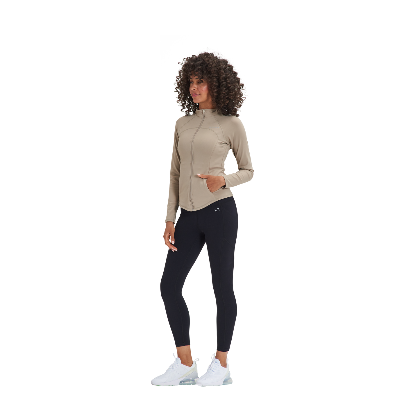 A woman wearing a Kulture Marina Sculpt Yoga Jacket with Pockets and black pants.