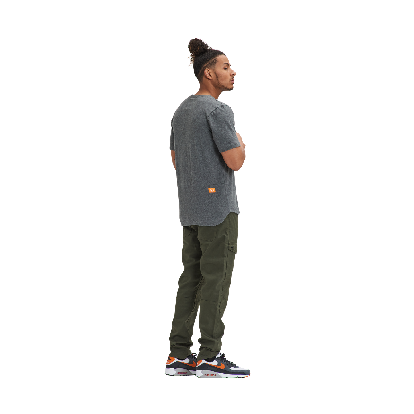 A man wearing a Kulture MIA Drop Cut Tee (3) PK Black / Charcoal / Heather and green pants.