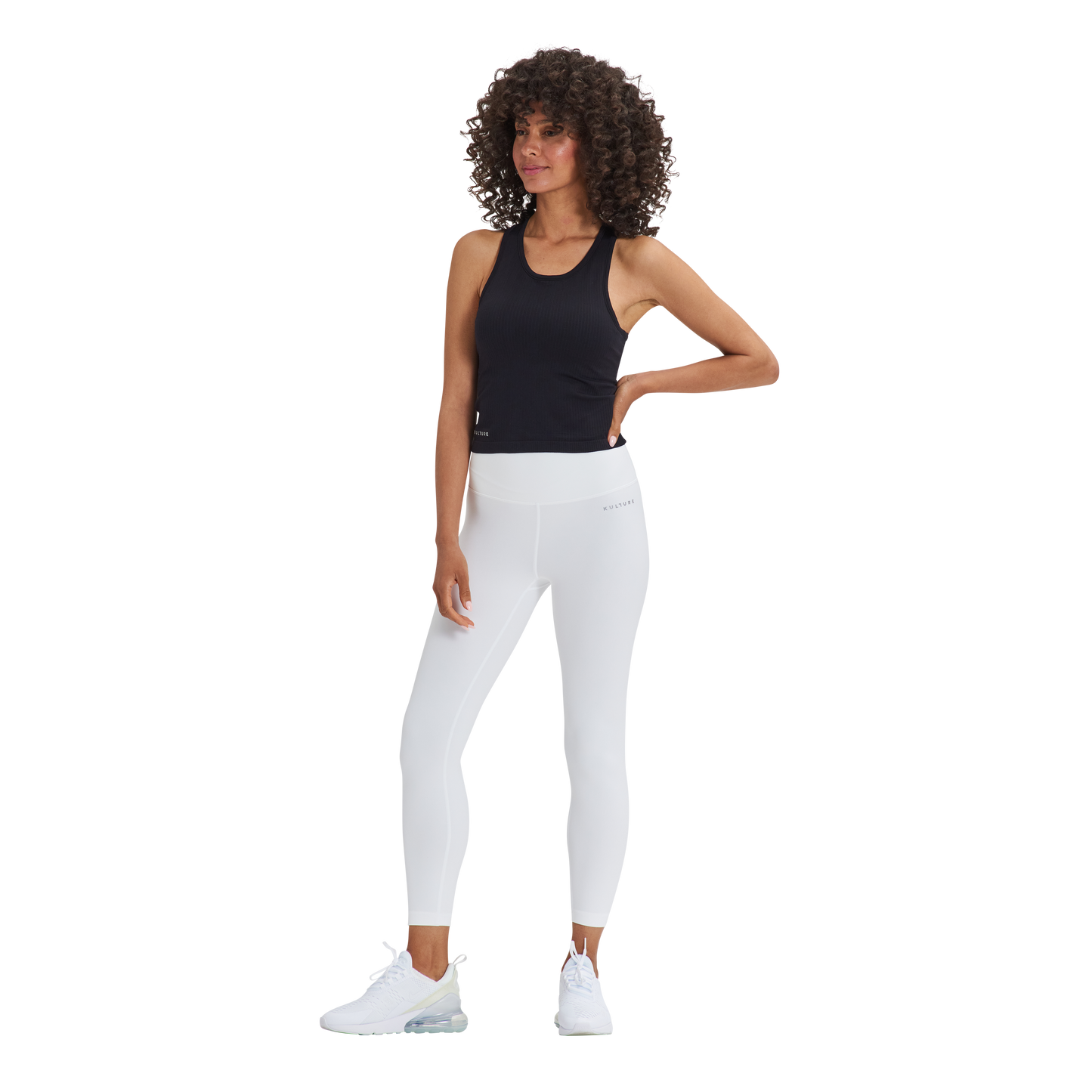 A woman in a Kulture black top and white Soho Sculpt Leggings.