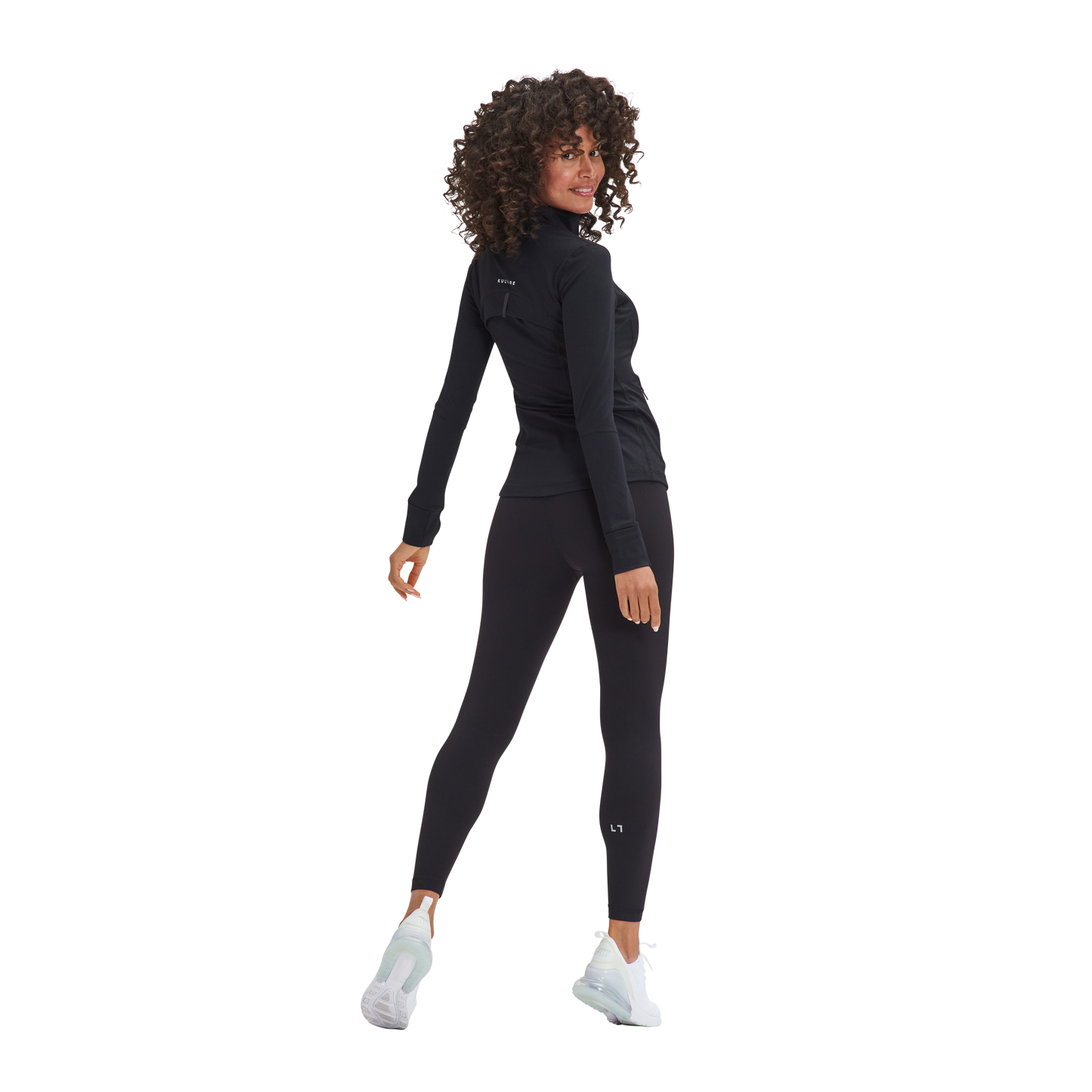 A woman in a Kulture Soho Sculpt Leggings and black top.