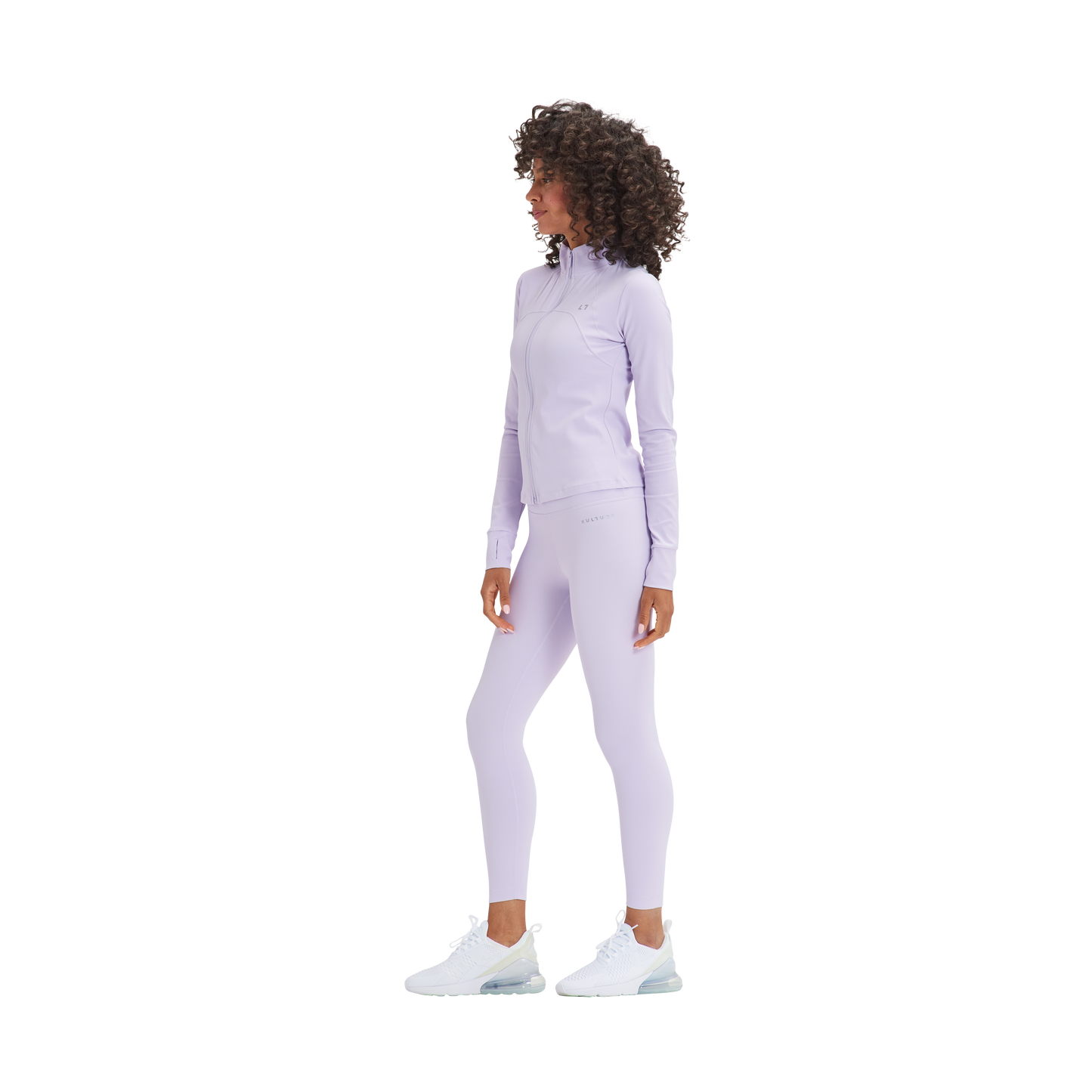 A woman in a Kulture Marina Sculpt Yoga Jacket and leggings.