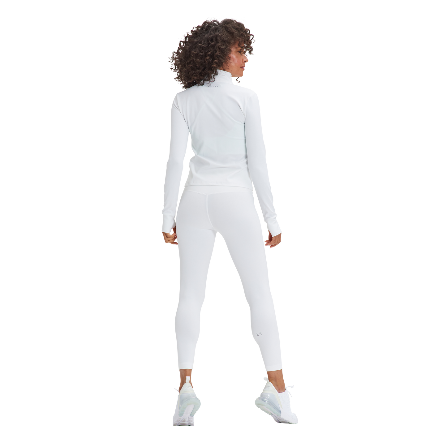 A woman in a white top and Kulture's Soho Sculpt Leggings.