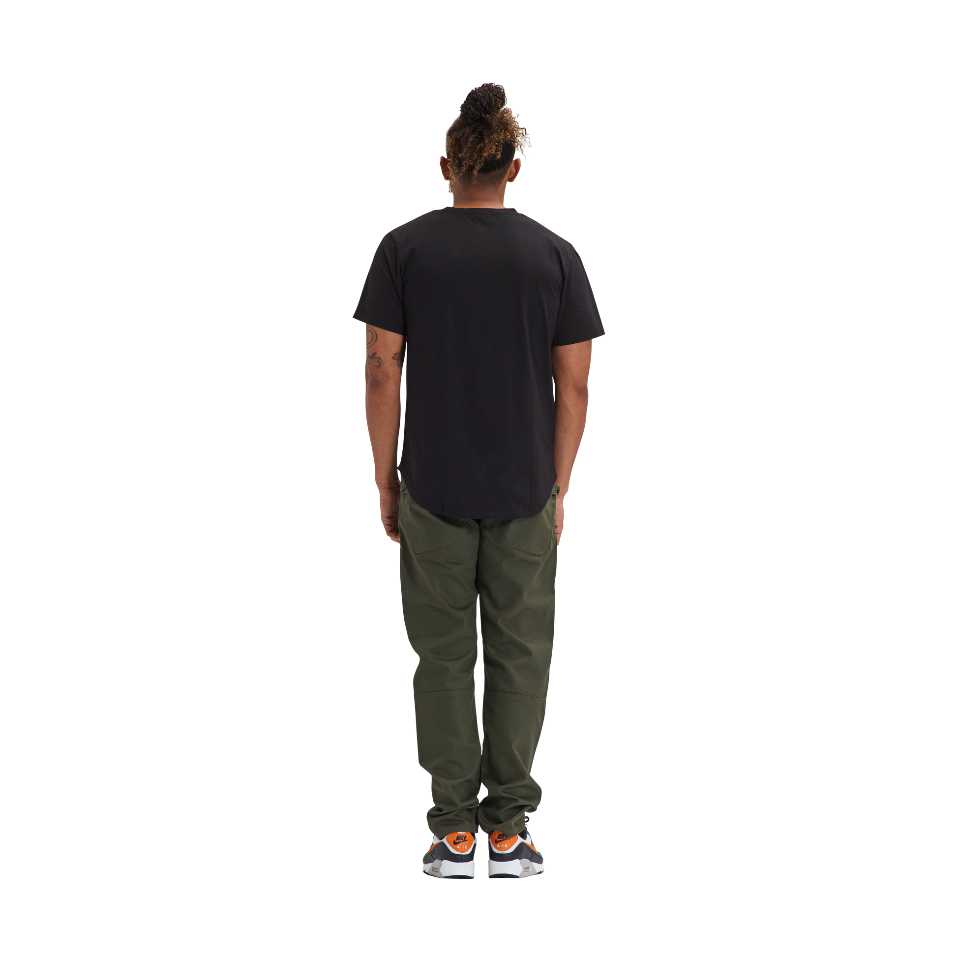 A man in a Kulture LAS Black Scoop Tee and khaki pants.