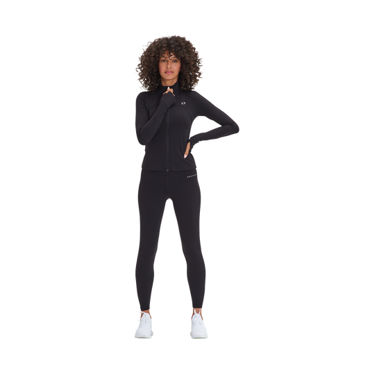 A woman in a Kulture black wetsuit posing for a picture.
