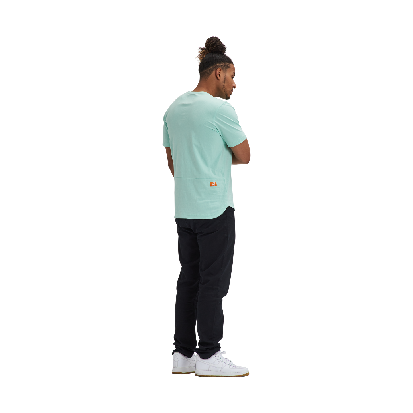 A man wearing a Kulture MIA Drop Cut Tee (3) PK White / Sand / Mint and black pants.