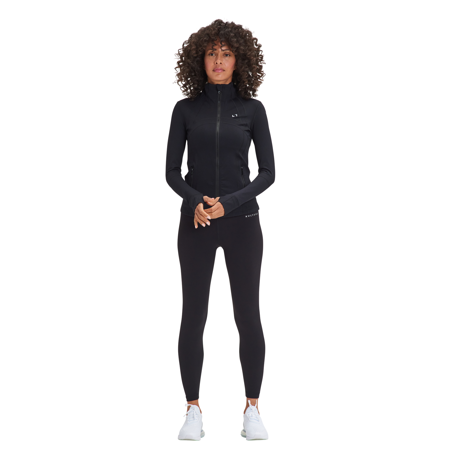 A woman in a black wetsuit and white sneakers wore the Kulture Sunset Define Full-Zip Jacket with Pockets.