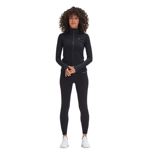 A woman in a black wetsuit and white sneakers wore the Kulture Sunset Define Full-Zip Jacket with Pockets.