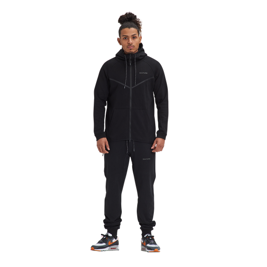 A man wearing a Kulture ATL Black Full-Zip Hoodie & Joggers.