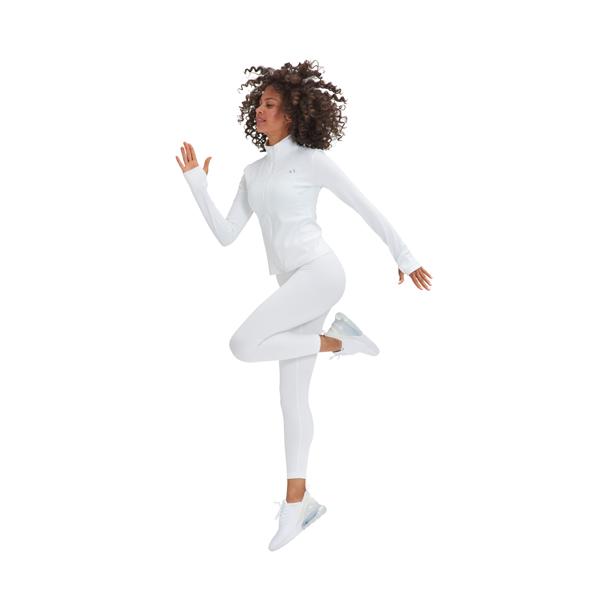 A woman in a white suit is jumping in the air wearing the Marina Sculpt Yoga Jacket by Kulture.