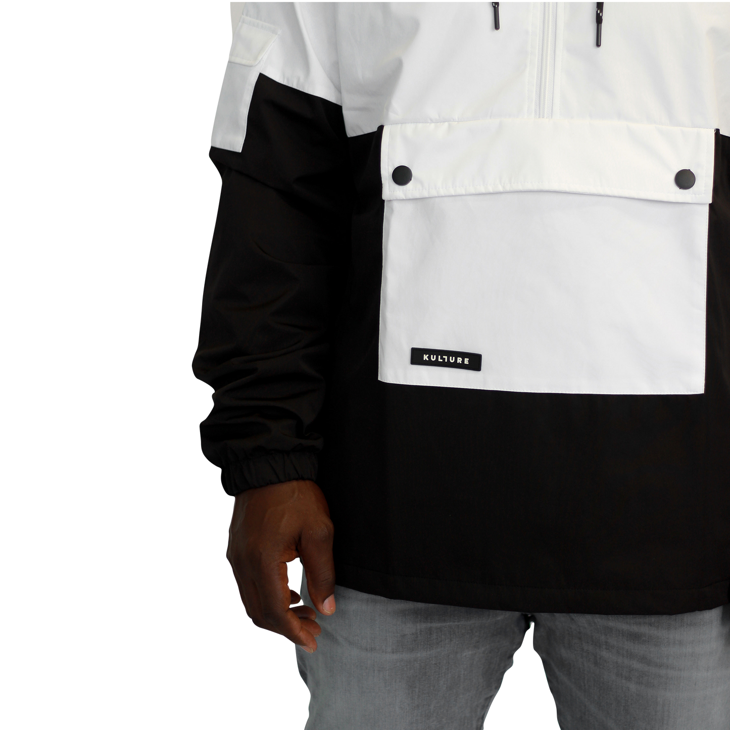 A man wearing a Kulture LAX V1 Hooded Anorak jacket in black and white.