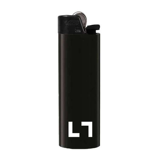The KULTURE "LT" Lighter by Klothing By KULTURE features a black body, metallic top, and white "L7" logo—an ideal addition to your essentials.